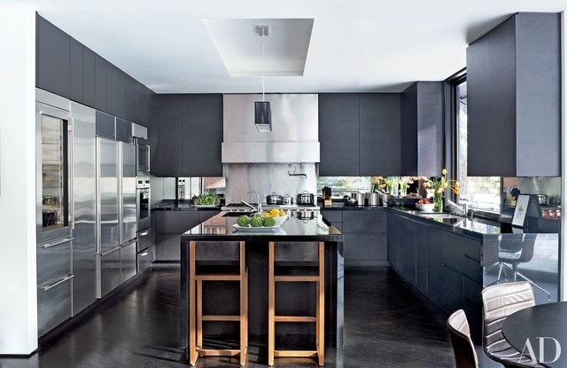 A dark gray modern kitchen after a renovation.