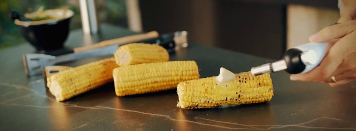 Grilled corn resting on Dekton counters.