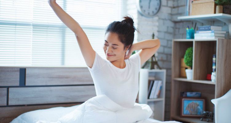 woman stretching after waking up