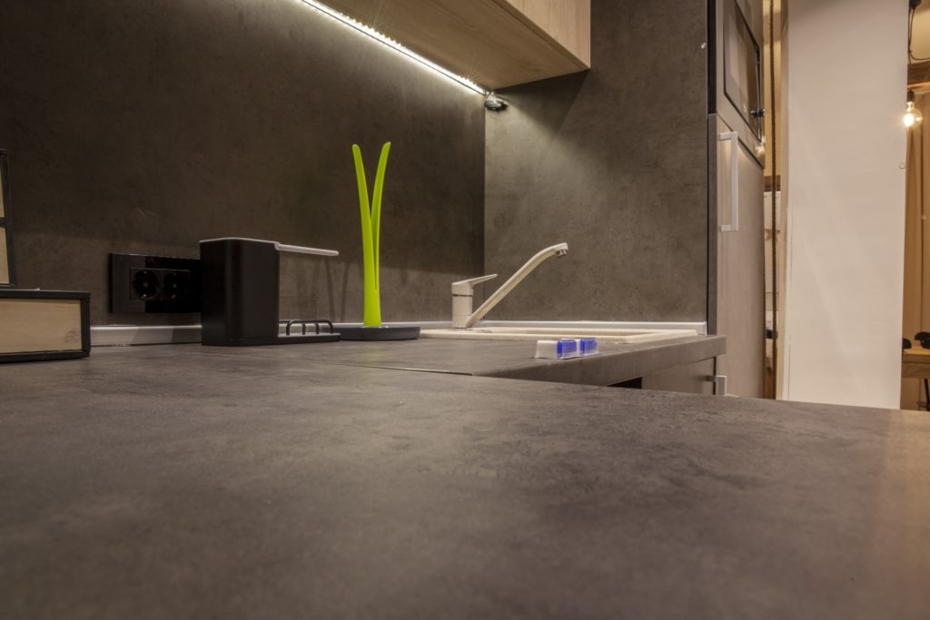 Dark concrete counters in a modern kitchen