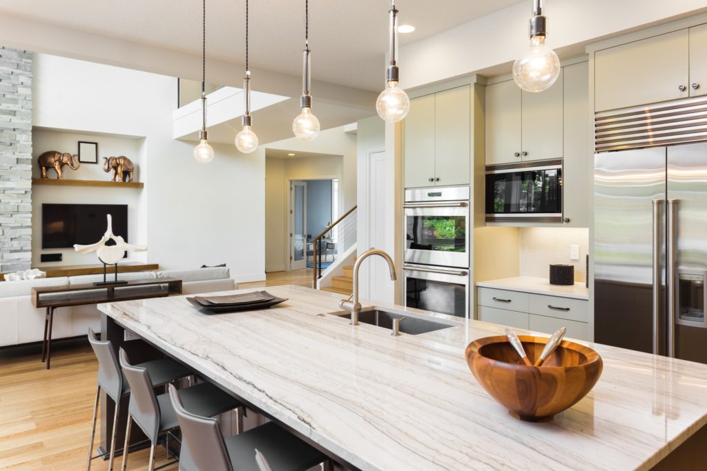 A kitchen with beautiful quartzite countertops. Quartz or quartzite is a beautiful kitchen countertop idea.