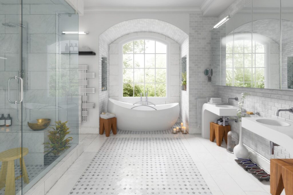 A bright white luxury bathroom with natural light from a window.