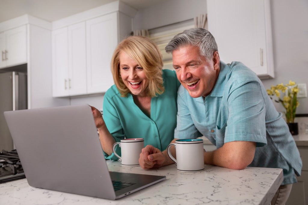 An older couple leaning on their warm stone counters from FeelsWarm